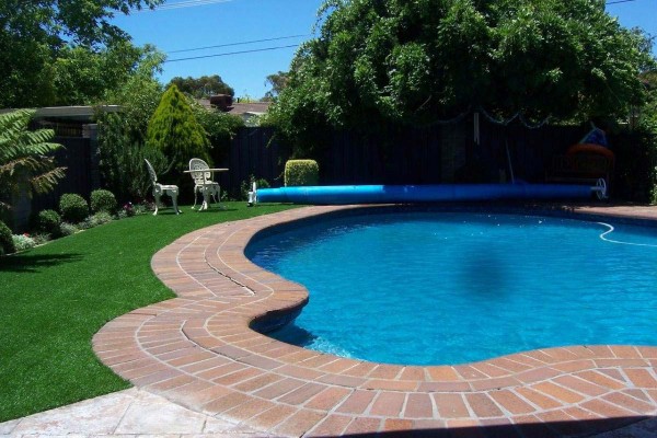 Artificial grass around swimming pull